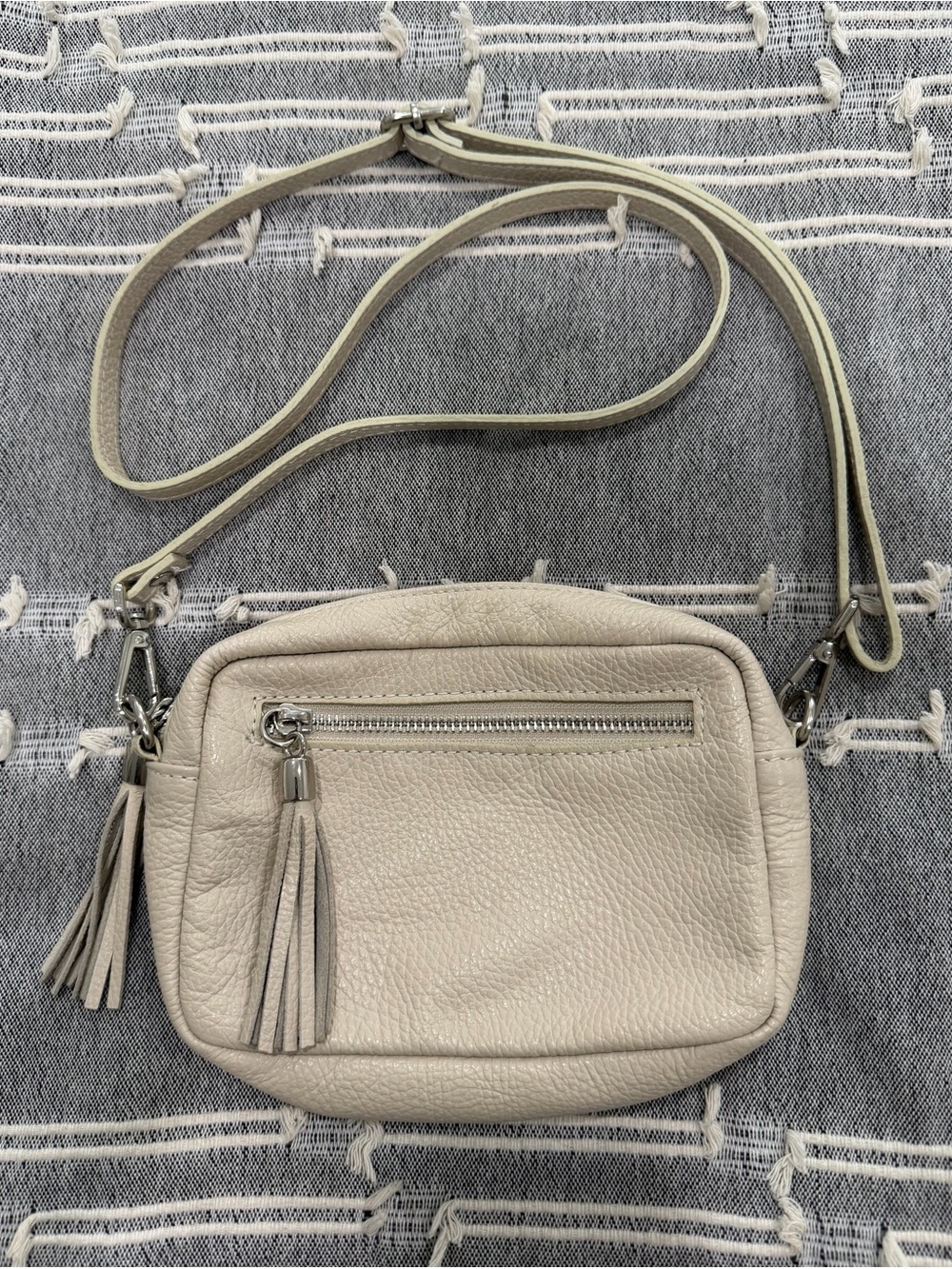 Italian Leather Compact Neutral Leather Crossbody Bag with Tassel Accent
